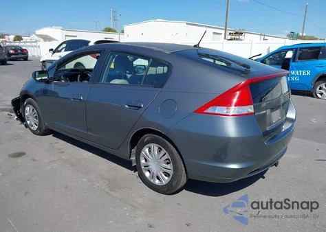 2011 Honda Insight from USA, damaged, VIN JHMZE2H32BS003362